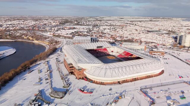 Sunderland UK: 3rd Jan 2026: Snow blankets the ground around Sunderland Stadium of Light after January winter storm. The white landscape makes the stadium stand out along the River Wear