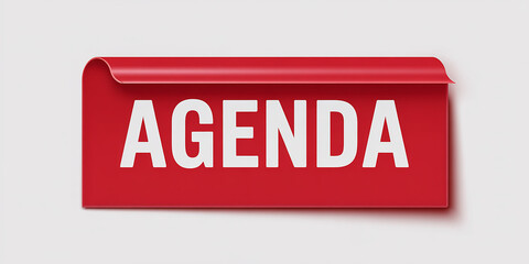 Red rectangular tab with the word AGENDA on a white background agenda ribbon