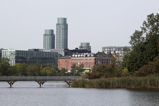 Copenhagen, Denmark - August 28, 2025: View of Copenhagen with Postbyen towers from Christianshavns Vold