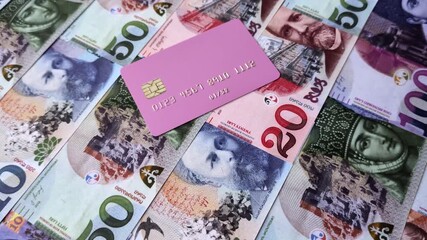 A credit card for contactless cashless payments via a terminal or online. A credit card for a financial background - Powered by Adobe