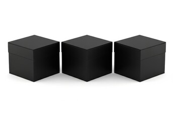 Fototapeta premium Three identical black cubic boxes arranged in a row isolated on white background