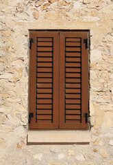 Wooden window shutters on a house