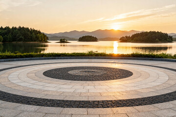 Sunset Over Circular Paved Area by Lake