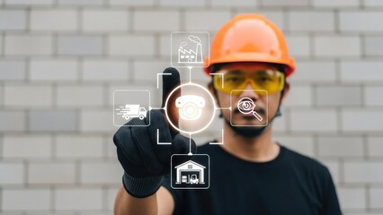 Man in hard hat interacting with futuristic industrial interface