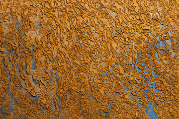 Abstract background with old rusty metal surface, closeup. Orange worn rusty metal texture