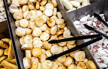 Sale of frozen semi-finished products. Showcase with different semi-finished products in chain hypermarket