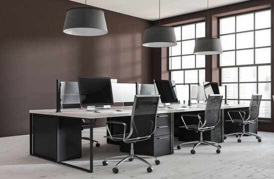 Contemporary office interior with ergonomic furniture and computer setups in a minimalistic design on a bright wooden floor background. 3D Rendering