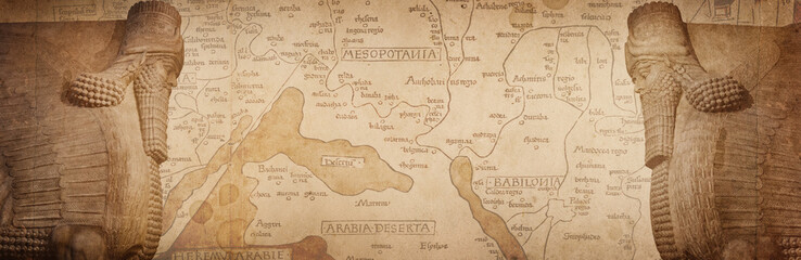 Ancient map and winged statue of Lamassu, a mythical Assyrian deity. Historical background on the theme of civilizations of Assyria, Mesopotamia, Babylon, interfluve, Sumerian.