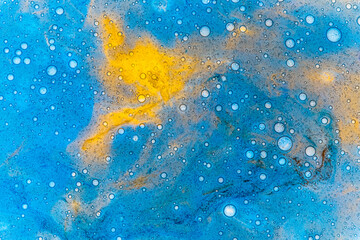 abstract photography of bubbles floating on a liquid surface, creating a textured pattern