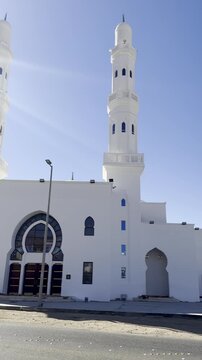 Bright daytime view of Masjid Areesh, a white Islamic mosque with twin minarets and elegant architecture, symbolizing faith, peace, and religious heritage under a clear blue sky.