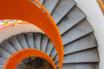 Bright orange and white  spiral staircase