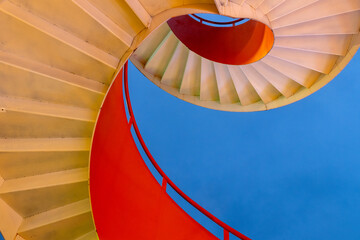 Bright orange and white  spiral staircase
