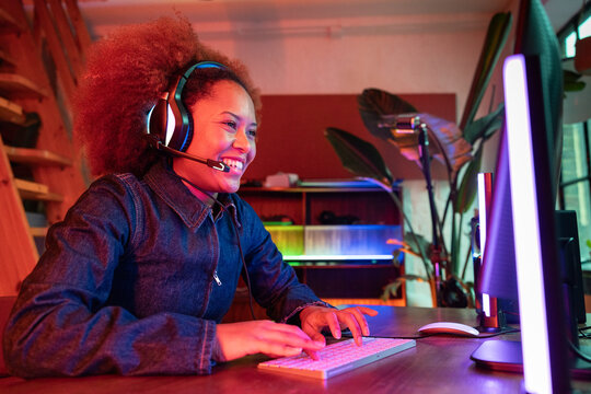 Smiling female gamer enjoying the digital experience