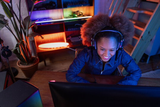 Gamer enjoying immersive setup with a smile