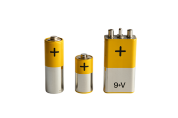 Batteries in different sizes with yellow and silver colors in bright studio lighting for electronics advertising