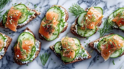 Smoked salmon canapes on cucumber rounds with creamy cheese spread and dill, arranged on marble for an elegant, healthy bite perfect appetizer for parties, brunches, or light entertaining