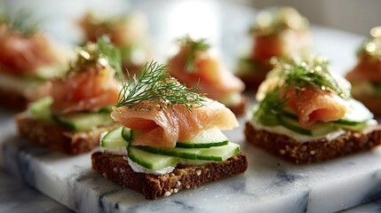 Smoked salmon canapes presenting fresh salmon slices layered on rye bread with creamy cheese, green cucumber slices, and savory dill, creating a gourmet appetizer on a marble board