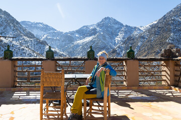 woman trekking in high atlas mountains, morocco