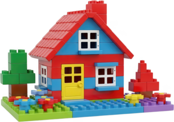 Colorful plastic building blocks form a cheerful red and blue house with a yellow door white windows green trees and vibrant flowers toy construction kids children creative transparent background