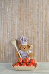 Teddy bear Chef cook Tomatoes