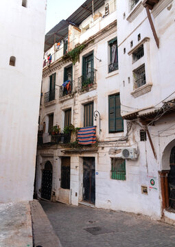 Algerian women sit in front an old building in the Casbah, North Africa, Algiers, Algeria