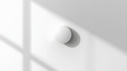 Simple Elegance: A minimalist, white sphere, casting a gentle shadow, hangs serenely against a stark backdrop, exemplifying modern design and understated beauty.