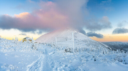 winter sunset in karkonosze mountains under Sniezka summit in Poland and Czech Republic