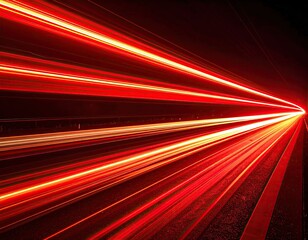 Long exposure shot of red light trails streaking across a dark background