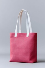 a red tote bag with two white straps, front view.