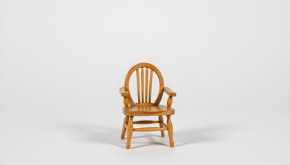A single wooden chair in a room with an off white wall. The chair is positioned slightly to the side of the frame, facing towards the center