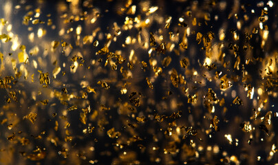 Gold backdrop of Luxury transparent cream gel with sparkling 24k gold floating particles serum, beauty products, wellness ads, cosmetic presentations. Skin care, face creme, mask, body lotion, moistur