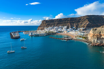 Puerto de Mog&aacute;n Marina and White Village at Sunset, Gran Canaria, Canary Islands - 4K Aerial View