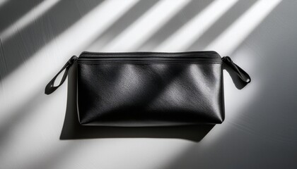 matte black pouch with window blind shadows editorial product photography for stylish modern branding