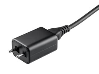 Close-up of a black power adapter plug ready for electronic devices, showcasing modern connectivity and design.