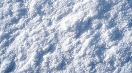 Textured fresh snow surface with glistening white crystals and soft blue