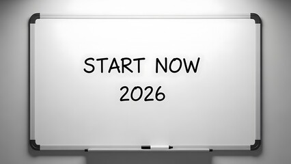 A whiteboard with the text START NOW 2026 written on it, placed against a gray background.