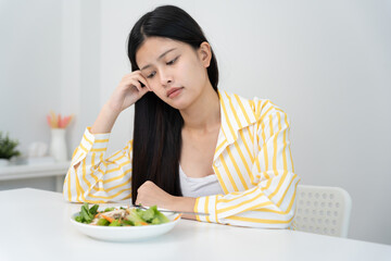 slim body asian women very bored diet food, dieting female choose low calories food for diet. Good healthy food. weight lose, balance, control, reduce fat, routines, exercise, body shape