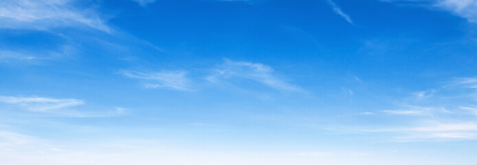 A clear blue sky with  clouds. The sky is so clear that it looks like a painting