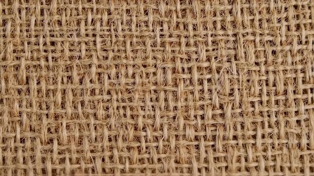 Detailed Close-Up of Burlap Fabric Texture and Weave.