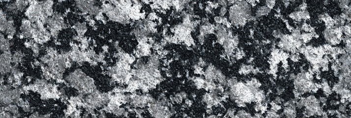 Natural granite stone texture background with detailed black white and grey patterns featuring rough mottled spots and heavy abstract grunge surface suitable for floor or wall architecture design