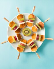 Mini pancakes and fruit skewers for healthy breakfast