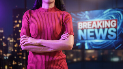 Female news presenter gestures confidently in modern studio, vibrant lighting, breaking news screen behind, professional broadcast, journalism, television media, live reporting studio background