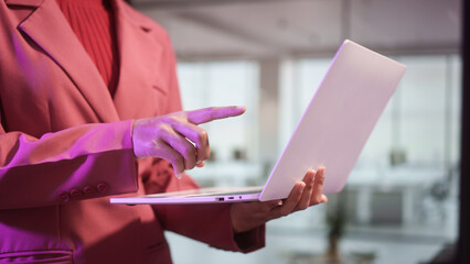 Professional businesswoman uses laptop in modern office, corporate environment technology workflow digital communication concept, leadership productivity innovation contemporary workspace