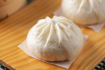 Traditional Chinese Bao Buns stuffed in a bamboo steamer