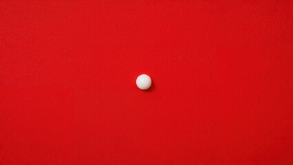 A small white ball on a solid red background.