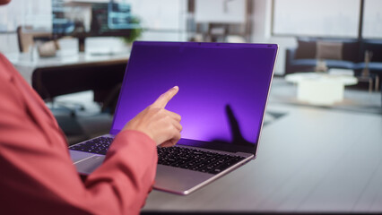Business professional presenting blank laptop screen in modern office, mockup display for digital content, technology showcase corporate communication workspace background, clean interface copy space