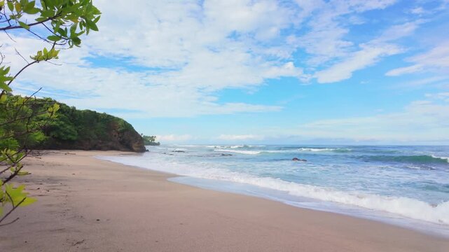 Tilt down camera movement of Playa Blanca beach scenery in Guanacaste