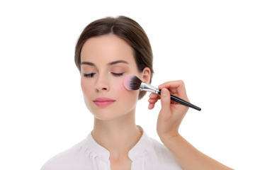 Woman getting makeup applied with brush by professional