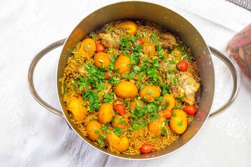 Traditional Goiana chicken stew, rice with pequi fruit. An iconic recipe from central Brazil. Pimenta biquinho
