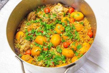 Traditional Goiana chicken stew, rice with pequi fruit. An iconic recipe from central Brazil. Pimenta biquinho